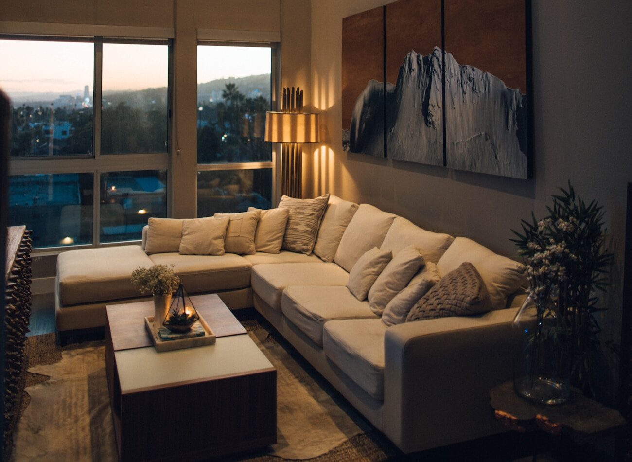 A warm living room with a long view over the city