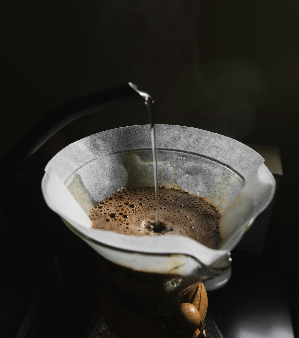 A pour-over brewing through a paper filter