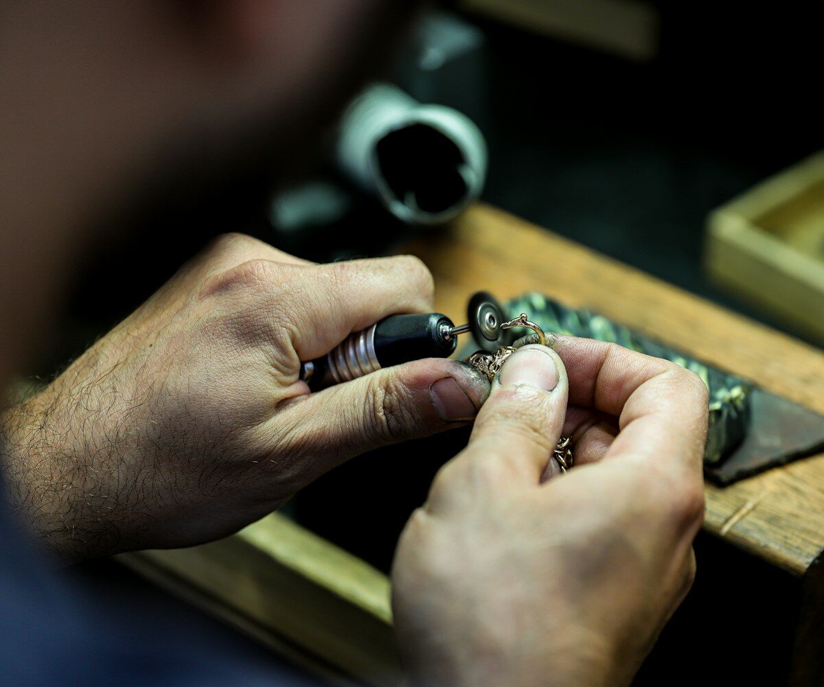 A jeweller setting a stone at the bench