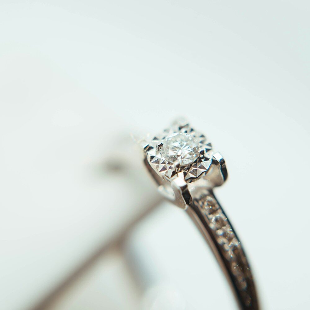 A brilliant diamond solitaire on a fine band